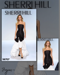 Shop Sherri Hill 58707, a strapless mermaid gown featuring a fitted silhouette and statement bow embellishment at Joyce’sTPR.